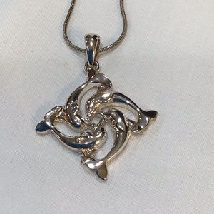 Dolphin design necklace in silvertone